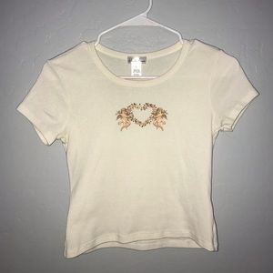 White Fawn floral angel shirt, children’s size large, color is cream